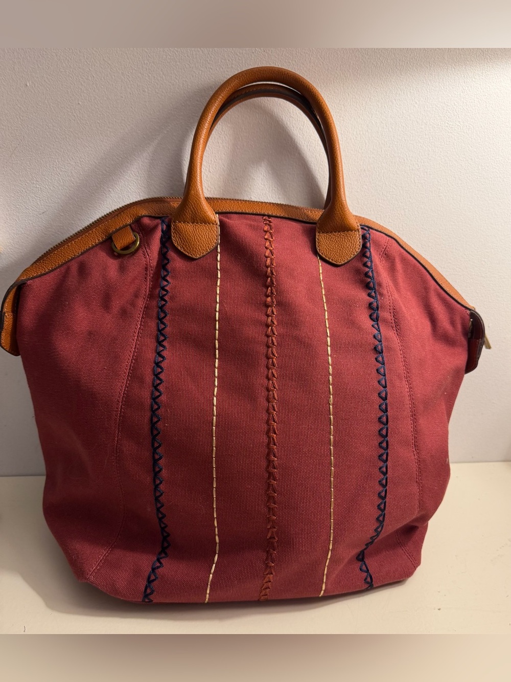 G.I.L.I. Large canvas tote with leather trim dual handles and crossbody strap.